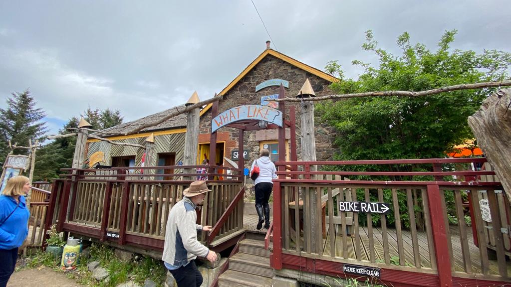 People entering the Cairn o'Mhor Winery visitor centre.