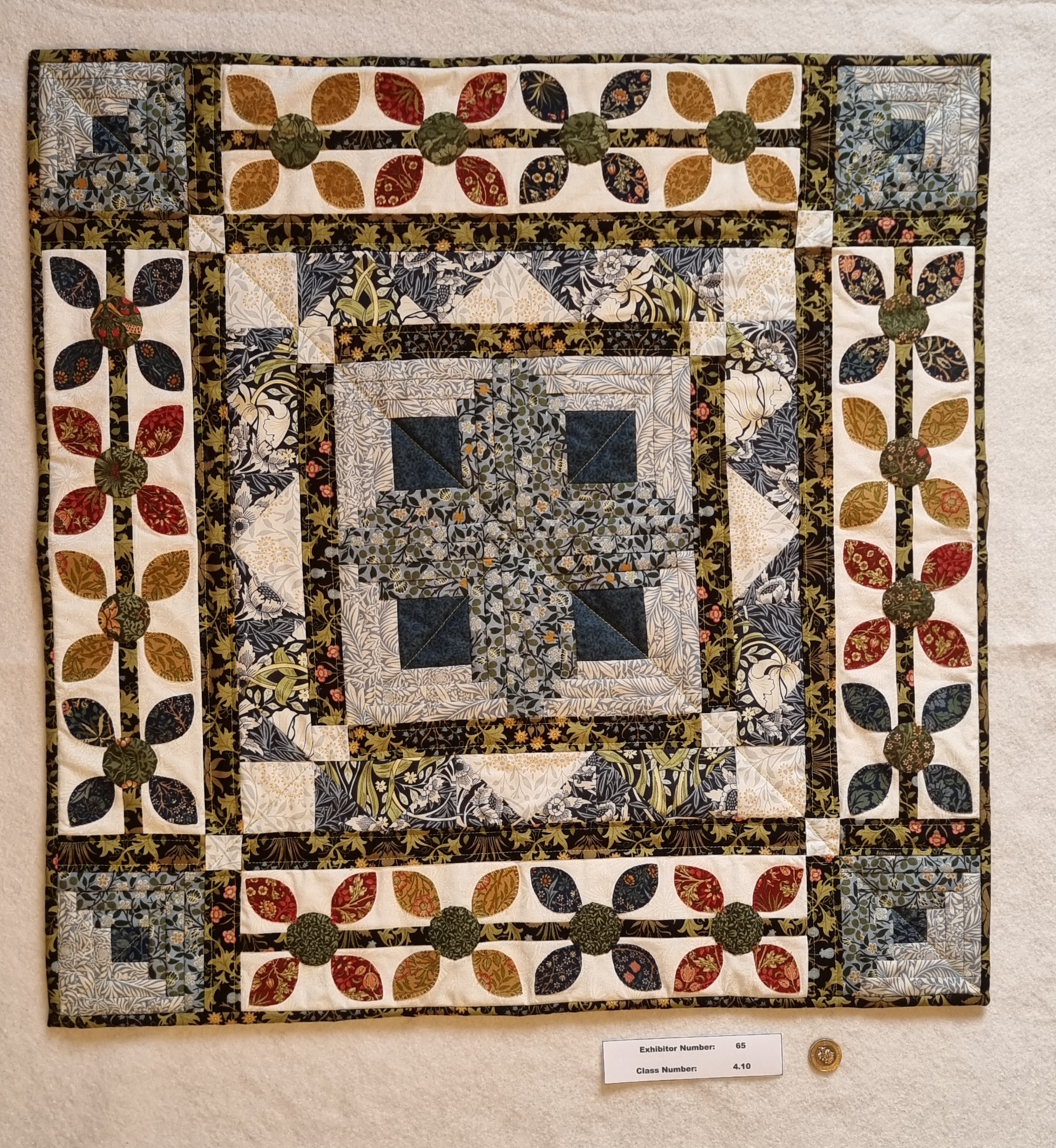 Best in Section Rosette: Awarded to C Fair for her entry in Class 4.10: A Patchwork item
